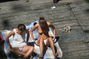 Two teens stripping and going topless to tan