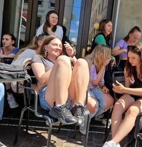 A Nice Candid Girl in a Top And Denim Shorts Hanging Out With Her Friends in a Street Cafe, Great Legs