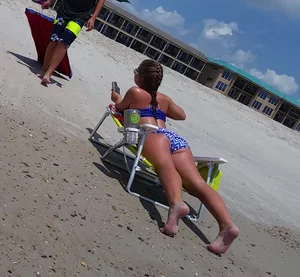 Girl in Swimsuit Lying on the Beach on Sunbed with Spread Legs Creepshots Gallery