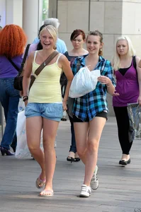 Pretty blonde and brunette friend walking in shorts