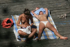 Two teens stripping and going topless to tan