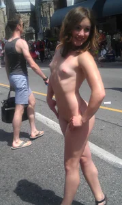 Nude small boobed girl at Toronto pride parade with a couple bonus girls