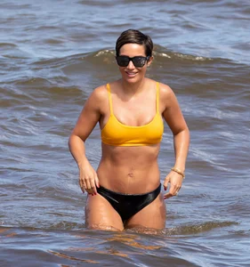 Frankie Bridge nip slips in a bikini on the beach
