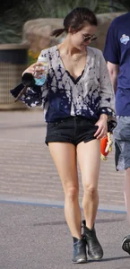 Cutie walking her dog in short denim shorts and showing a bit of cheek