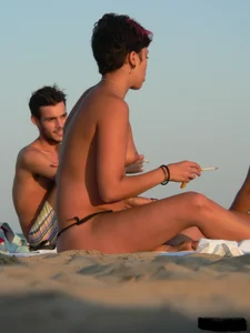 Sexy girls going topless at the beach showing off their sexy bodies