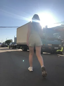 Girl With Nice Ass in Shorts and Legs Passing By on a Street Candid Photos