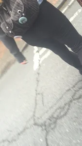 Girl with a nice ass in leggings walking down the street