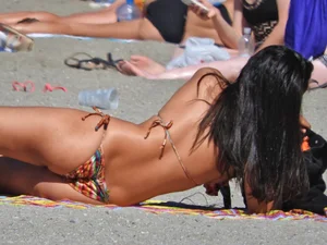 Pretty brunette in a bikini at the beach
