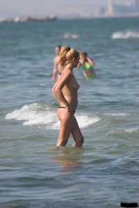 A bunch of sexy beach voyeur babes in bikinis, thongs and topless