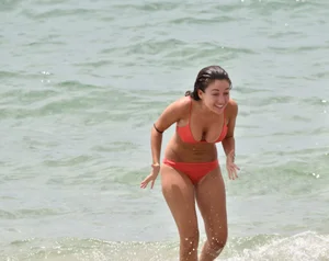Two sexy ass girls on the beach in bikinis