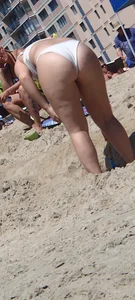 Big booty teen at the beach in a white bikini