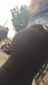 Girl with a nice ass in leggings walking down the street