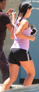 Hot brunette running in short shorts with vpl