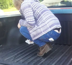 Squatting Girl With Whale Tail Panties Sticking From Under Tight Jeans