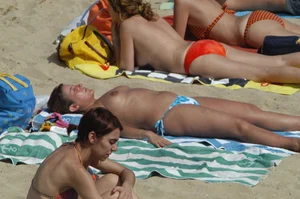 Topless girls on a beach in Barcelona