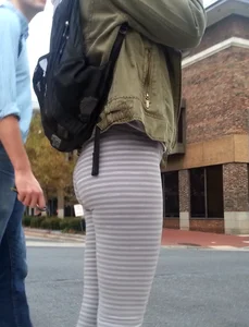 College girl in striped leggings walking with nice ass
