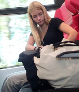 Hot busty blonde on train