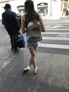 Cute candid girl in tight shorts on a crosswalk