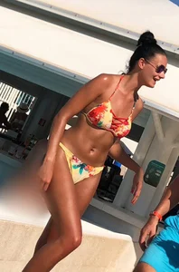 Skinny and sexy tanned bikini girl out at the pool