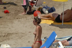 Girls on a nude beach in Sitges, Spain