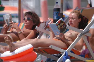Girls on a nude beach in Bibione, Italy