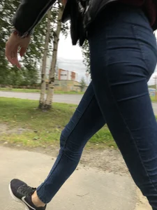 Young Blonde Girl in Tight Blue Jeans Scratching Her Booty While Passing By on the Suburban Street Creepshots Gallery