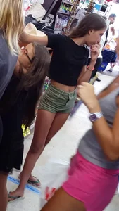 Cute girl wearing shorts and a top at the supermarket