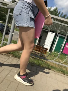 Cute Girl in Denim Shorts Walking Down a Railway Station Gallery
