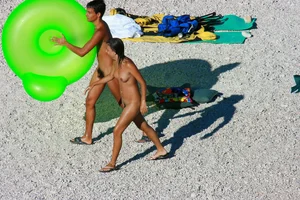 FKK Nudists playing in the water with floater