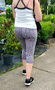 Milf booty in tight leggings shopping for plants