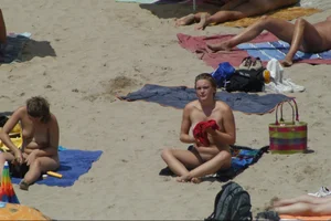 Girls on a nude beach in Sitges, Spain