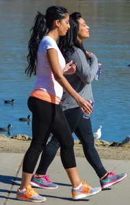 Thick lady walking in leggings with a big booty