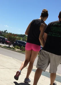 Sexy girl with a nice ass in tight pink spandex shorts