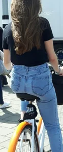 Teen girl in jeans on a bike