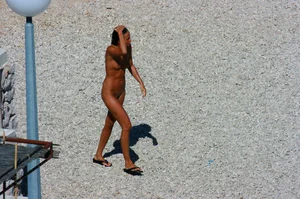 Ula FKK Sexy brunette on a nude beach topless, bottomless and with blue thong