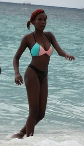 Candid black family, milf and teens on the beach in bikinis