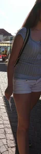 Pretty blonde babe with nice legs in white denim shorts