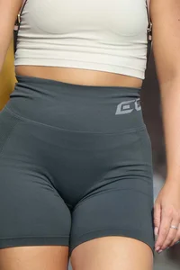 Blonde woman in lycra shorts - good front view, back view ruined by a bag