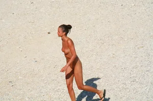 Ula FKK Sexy brunette on a nude beach topless, bottomless and with blue thong