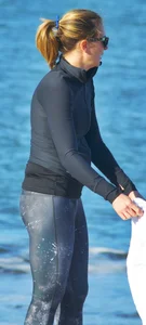 Beach redhead milf in patterened leggings at the beach