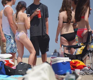 Group of sexy girls on the beach in bikinis with nice bodies