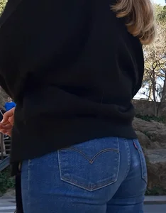 Two beautiful teens in jeans. One white and one blue jeans