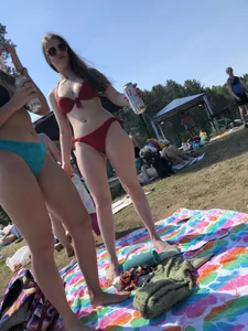 Hot Girls in Swimsuits Holding Beers at the Beach