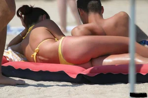 Beach voyeur girls in bikinis, thongs and topless