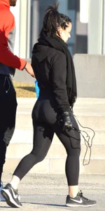 Brunette walking in leggings with a thick booty and showing some camel toe