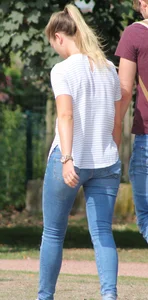 Blonde chick walking with her boyfriend in tight jeans