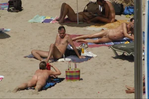 Girls on a nude beach in Sitges, Spain