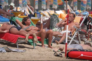 Girls on a nude beach in Bibione, Italy