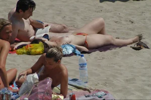 Girls on a nude beach in Sitges, Spain
