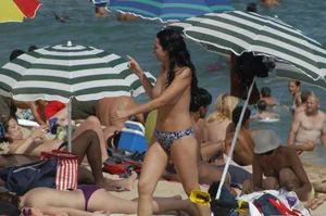 Topless girls on a beach in Barcelona